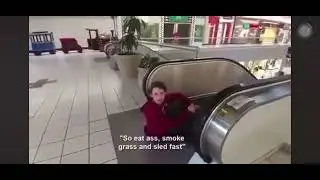 Dan, the meme man sledding down the escalator at Dayton mall