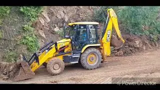 Jcb working on clearing road blocked