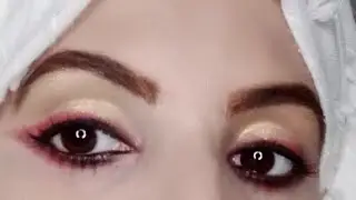 golden eyes makeup with red eye liner