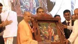 H.H.Radhanath Swami Maharaj gifts a painting of Sri Sri Radha Krishna to Radha Krishna Prabhu