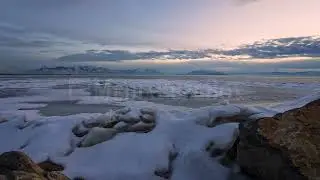 Stock Video - Sunset timelapse moving past rocks and ice