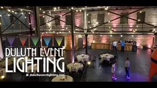 Malting building in blush pink and white up lighting for a wedding