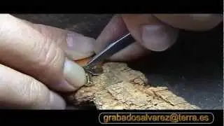 grabado a buril de una medalla