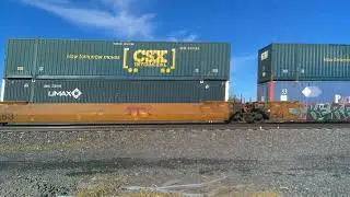 UP 7964 leading z-train with autoracks west of Gibbon