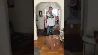 Lifting a 50 lb box using functional fitness and common sense.