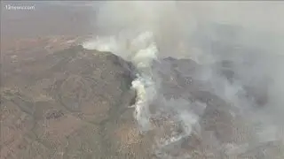 Firefighters working to slow Woodbury Fire progression toward homes