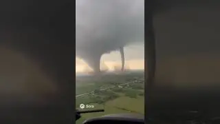 Twin tornadoes coming together