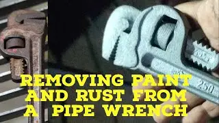 Removing paint and rust from a pipe wernch