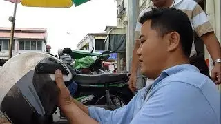 Discover Penang George Town - Roadside Helmet Repair