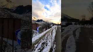 Snowy Roads and Majestic Mountain Views with a Touch of Sunlight #snowy #majestic #mountains #sunset