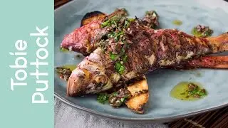 Grilled red mullet, black olive sauce and bruschetta
