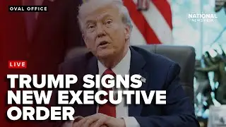 President Donald Trump signs a new executive order from the oval office
