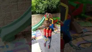 Firefighter CJ...trying out a toy backpack fire spray gun