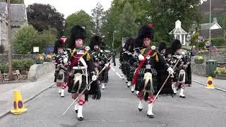 Scottish pipe band marches as the Lonach Pipe Band march to the 2018 Braemar Gathering in Scotland