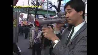 Super Salaryman playing Super Famicom with the Super Scope.