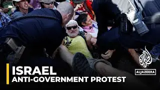 Protesters sit outside Israeli Knesset calling for new election
