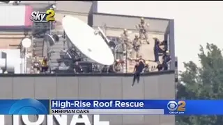 First Responders Leap Into Action To Keep Woman From Jumping Off 22-Story Building