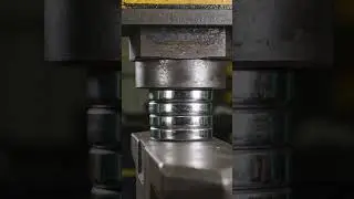 Hydraulic press vs stacked ball bearings, sudden explosive escape, slow motion chaos.