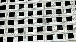 Moscow apartment building under construction, unfinished concrete facade and block windows