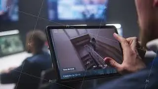 Security officer zoom CCTV cameras uses tablet