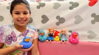 Playing with little Elsa & Anna dolls and gems - rubber duck - dog