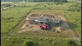 Watch the entire exterior construction unfold step-by-step from a fixed cinematic drone view