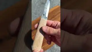 Modern puukko with handforged blade and coyote canvas micarta handle. It&rsquo;s for sale.