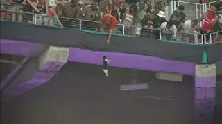 Falling cat caught in American flag at Hard Rock Stadium during Miami game.
