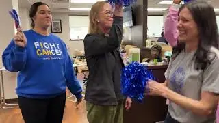 Marianne rings the end-of-cancer-treatment bell.