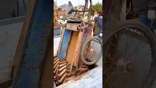 Old Rickshaw Being Crushed for Recycling