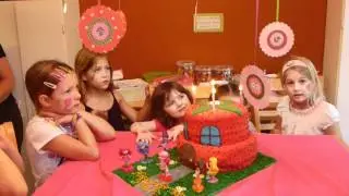 Katie's 4th Birthday party blowing out her candles