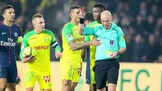 Referee kicks out  and sent off Nantes defender Diego Carlos for tripping him up