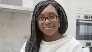 UK new Tory party leader, black Nigerian chic with dreads, asks questions in UK parliament.