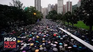 Nearly 2 million protest in Hong Kong, as Chinese forces gather near the border