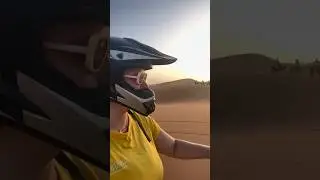 Riding ATV quad at sunrise in the Sahara Desert located in Merzouga, Morocco