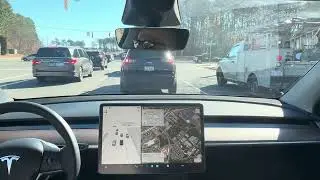 Tesla Model Y Performance 12.6.4 - Navigating around a mail truck