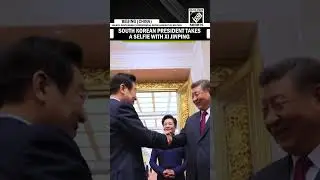 South Korean President Lee Jae Myung takes a selfie with Chinese counterpart Xi Jinping