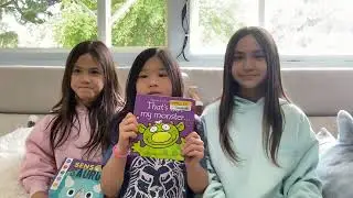 Reading books from half price books Avery, Kenzie, and Morgan.