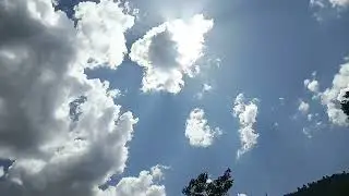 White clouds clearing the blue sky - TimeLapse