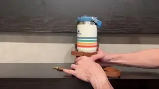 Hand model showing how to use adjustable strap coffee cup holder!