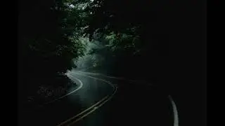 Slow life is playing but you're in your car, driving in the rain