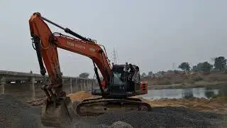Excavator working on gravel collected/tata HITACHI INFRA EX200 SUPER excavator 