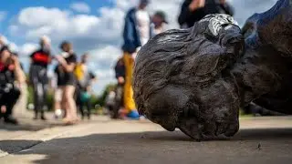 Baltimore protesters toppled a Christopher Columbus statue and threw it in