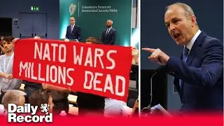 Anti-NATO protesters interrupt address by Ireland's T&aacute;naiste Micheal Martin