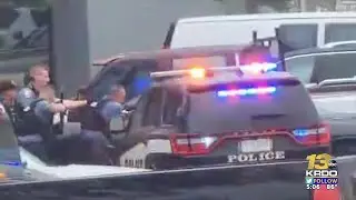 Driver in stolen vehicle escapes police blockade, crashes into business, escapes, remains at ...