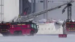 Toronto plane crash: Photos of Delta jet upside down