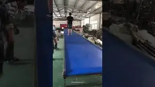 Wide blue color belt long conveyor one person stand up conveyor testing video