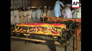 WRAP 23 dead in bombings; scene, funerals