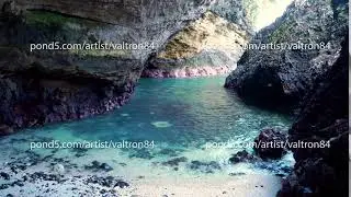 a view from the inside of a beach cave looking out at the sea. Bali, Indonesia