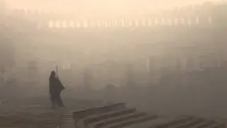 Woman Sweeping in the fog: Lucknow, India - Stock Video